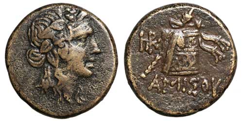 A brass coin of Amisos showing Dionysos and a cista