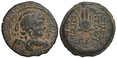 A bronze coin of the Seleucid Antiochos VII with a bust of Eros and Isis's headdress.