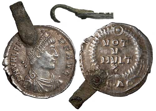 A siliqua of Valens with a bronze hook fixed to it.