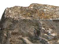 Edge of a broken Hadrian denarius