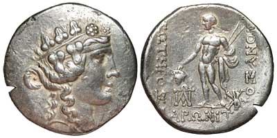A silver tetradrachm of Maroneia showing the head of Dionysos and Dionysos with two narthex wands.
