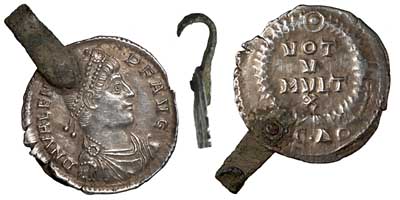 Silver siliqua of Valens with an attached hook.